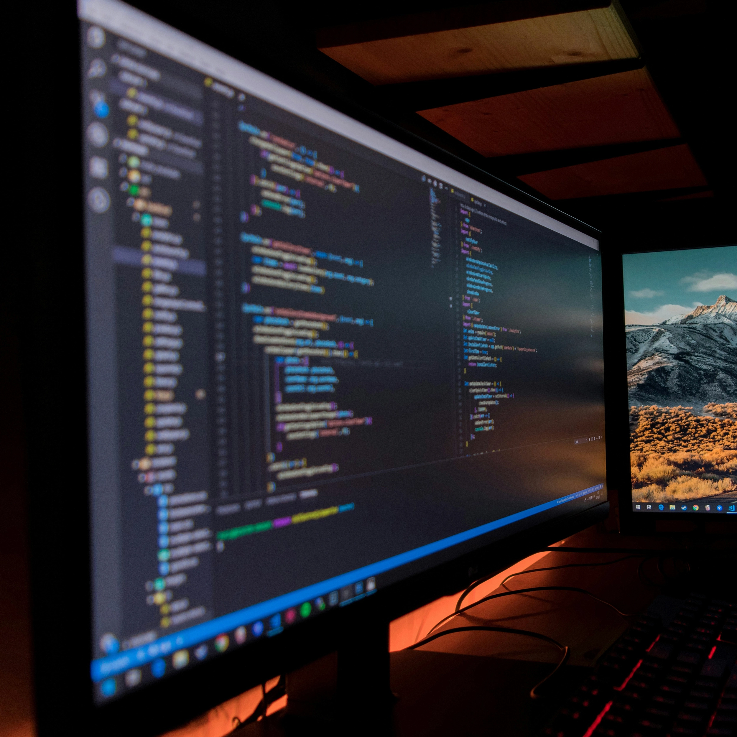 Two computer screens both with code on highlighting PSP's business IT support services